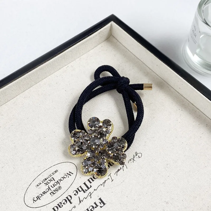2025 Nuevo Y Digno Rhinestone Cuerda Para El Pelo Niña Estilo Coreano A La Moda Anillo Para El Pelo Banda De Goma Elástica Alta Cuerda Para Cabeza De Trébol display picture 10