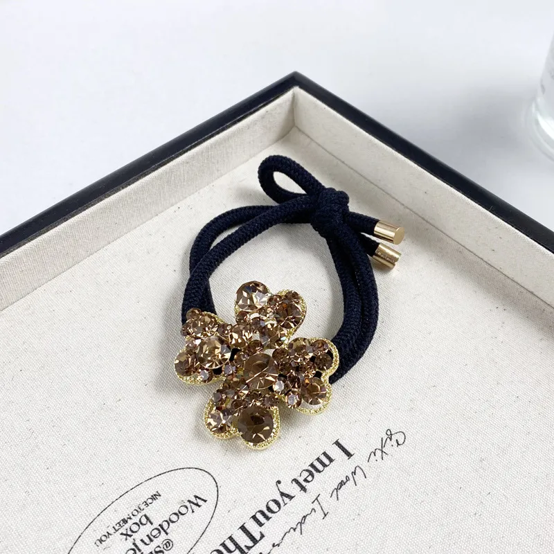 2025 Nuevo Y Digno Rhinestone Cuerda Para El Pelo Niña Estilo Coreano A La Moda Anillo Para El Pelo Banda De Goma Elástica Alta Cuerda Para Cabeza De Trébol display picture 7