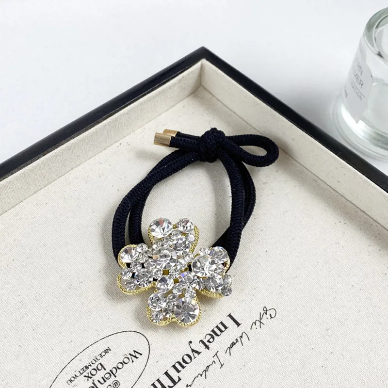 2025 Nuevo Y Digno Rhinestone Cuerda Para El Pelo Niña Estilo Coreano A La Moda Anillo Para El Pelo Banda De Goma Elástica Alta Cuerda Para Cabeza De Trébol display picture 8