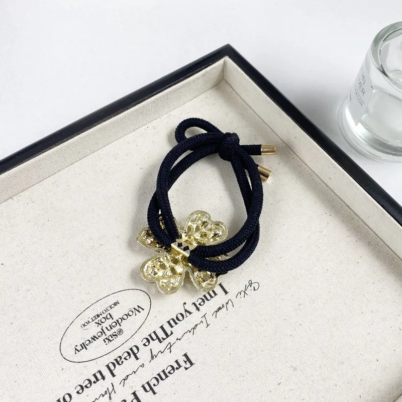 2025 New Dignified Rhinestone Hair Rope Girl New Style Fashion Hair Ring Tie Hair High Elastic Rubber Band Clover Head Rope display picture 11