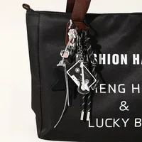 Style Moderne Acrylique Alliage Gel De Silice Guitare Star Ruban Femmes Pendentif De Sac Porte-Clés main image 6