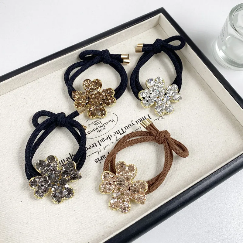 2025 Nuevo Y Digno Rhinestone Cuerda Para El Pelo Niña Estilo Coreano A La Moda Anillo Para El Pelo Banda De Goma Elástica Alta Cuerda Para Cabeza De Trébol